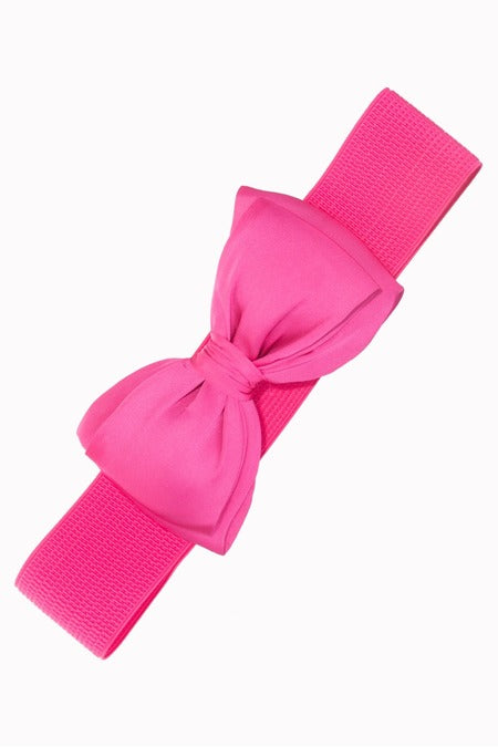 Pink belt with a large bow on a white background