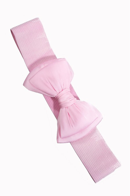 Pink belt with a large bow on a white background
