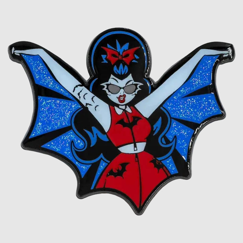 Vampire-themed enamel pin with blue bat wings and red outfit on a white background