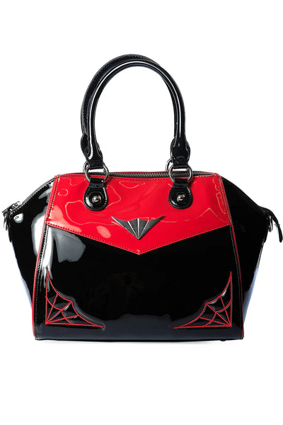 Black and red handbag with spider web design on a white background