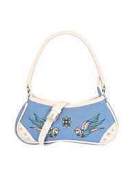 Handbag with bird designs on a light blue background