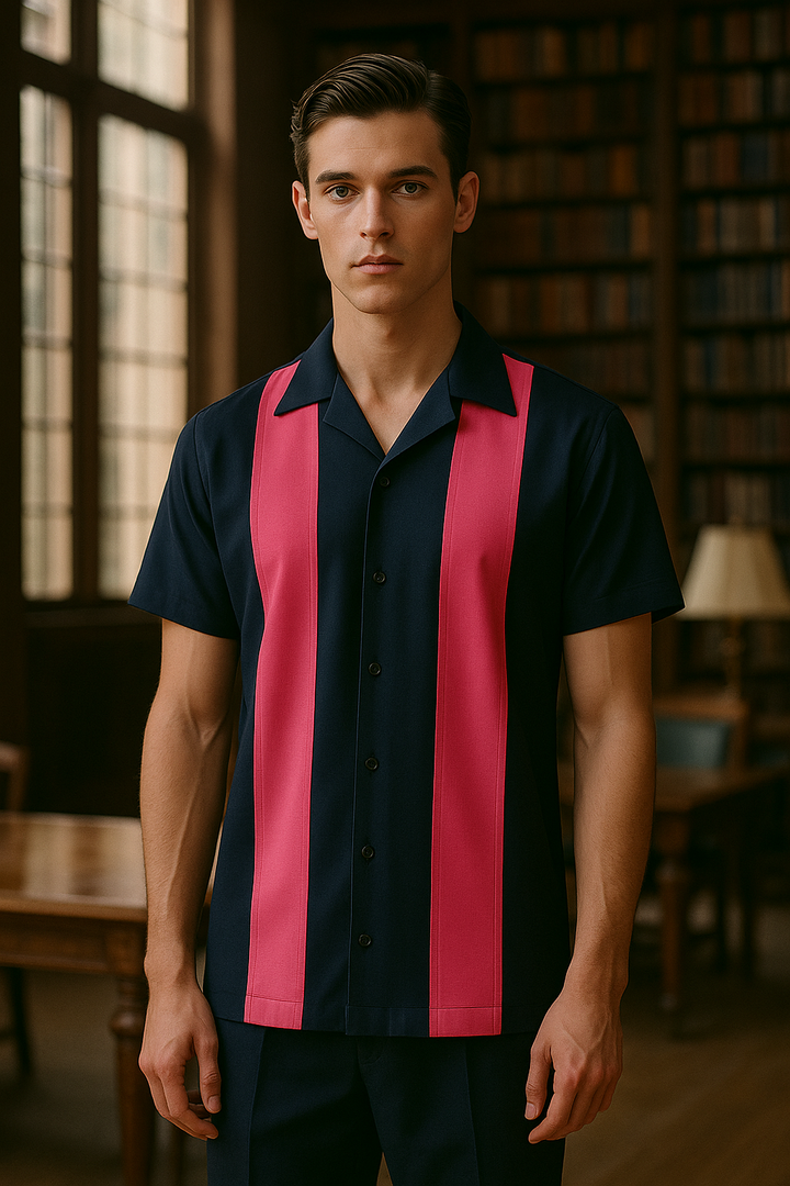 Man wearing a black and pink striped shirt in a library setting