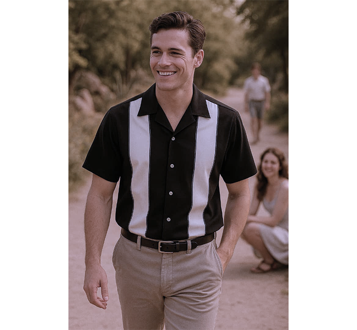Man wearing a black and white striped shirt with a blurred background