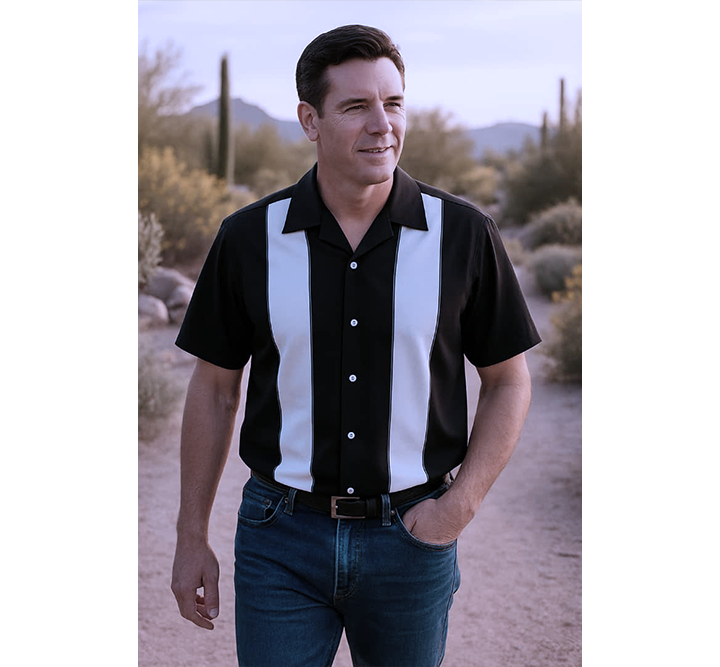 Man wearing a black and white striped shirt in a desert setting