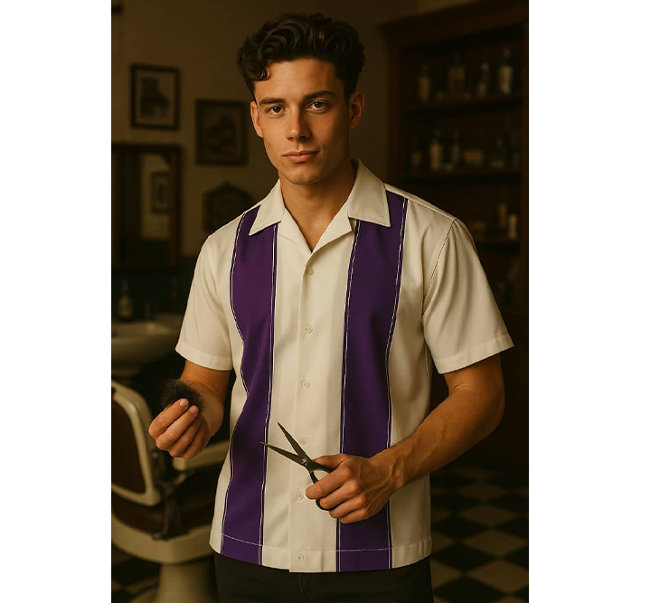 Man wearing a Cream shirt with purple stripes holding scissors in a barbershop setting.