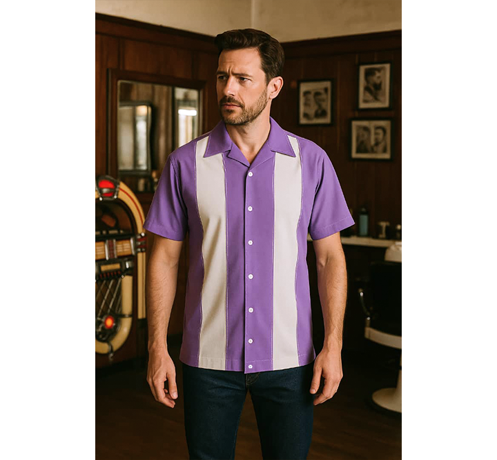 Man wearing a Lilac and white striped shirt in a room with wooden paneling and framed pictures.