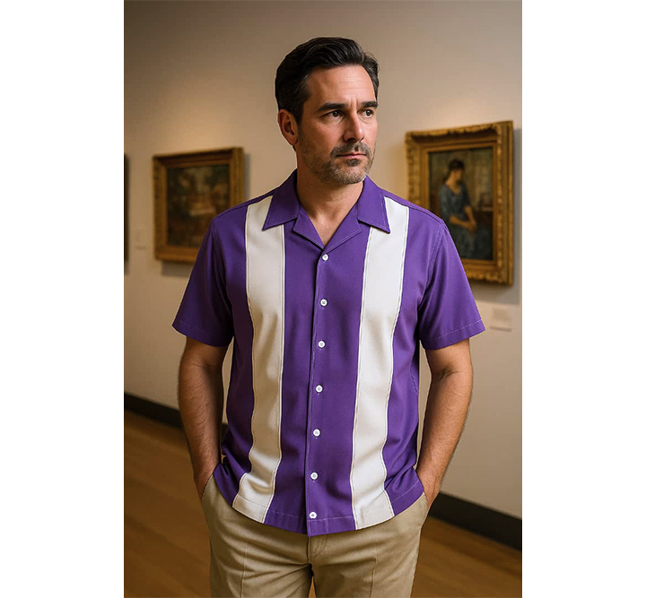 Man wearing a Lilac and white striped shirt in an indoor setting with paintings on the wall.