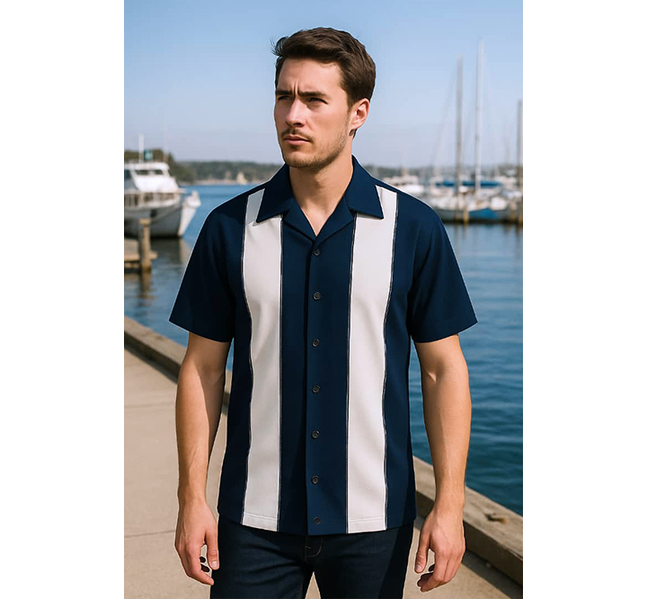 Man wearing a navy and white striped shirt by a marina