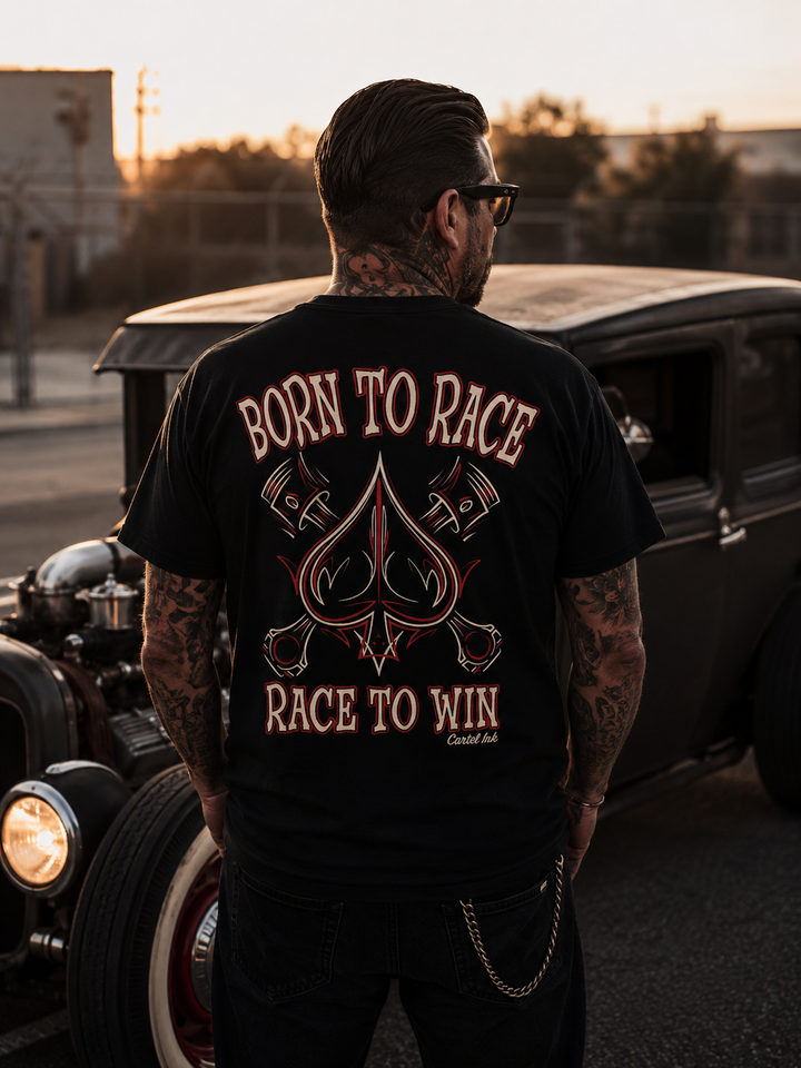 Image standing behind a man looking at a hot rod wearing a black t-shirt with bold "born to Race" printed and pin striping  on the back 