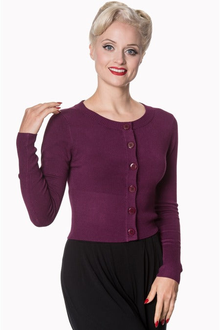 image of lady wearing a aubergine cardigan and black skirt