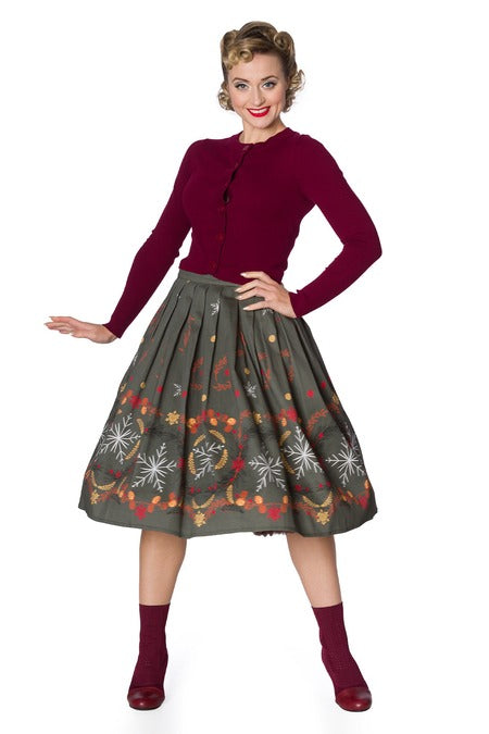 full length image of Burgundy cropped cardigan on lady with skirt with white background