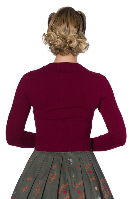 back view of Burgundy cropped cardigan on lady with skirt with white background