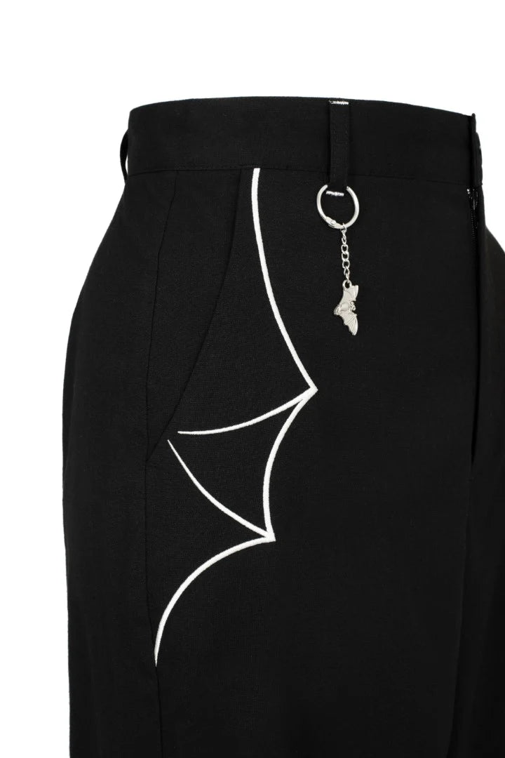 Black skirt with white bat design and keychain on a white background