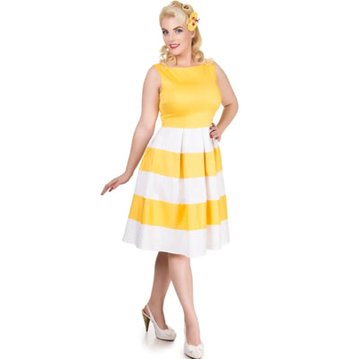 Front view of blonde lady wearing a yellow and white striped dress and heels