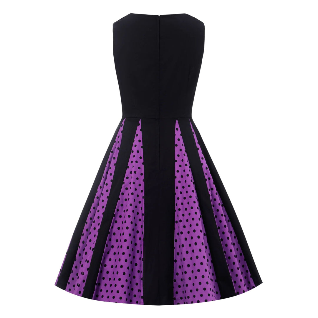 Back image of a black dress with purple pleats with black polka dots in the pleats