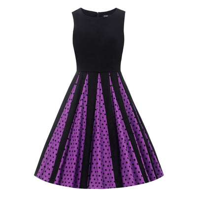 front image of a black dress with purple pleats with black polka dots in the pleats