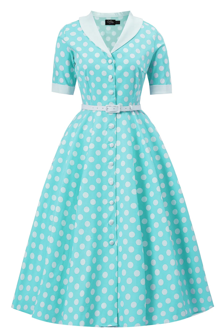 front view of Turquoise dress with white polka dots on a white background