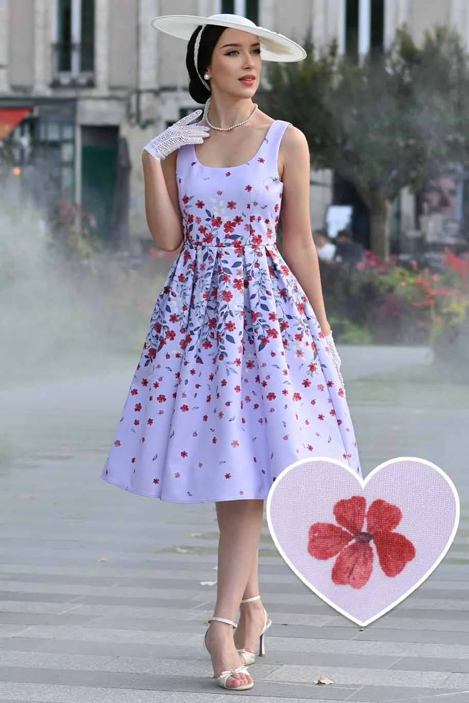 Woman in a floral dress standing outdoors with a heart-shaped inset of a red flower.