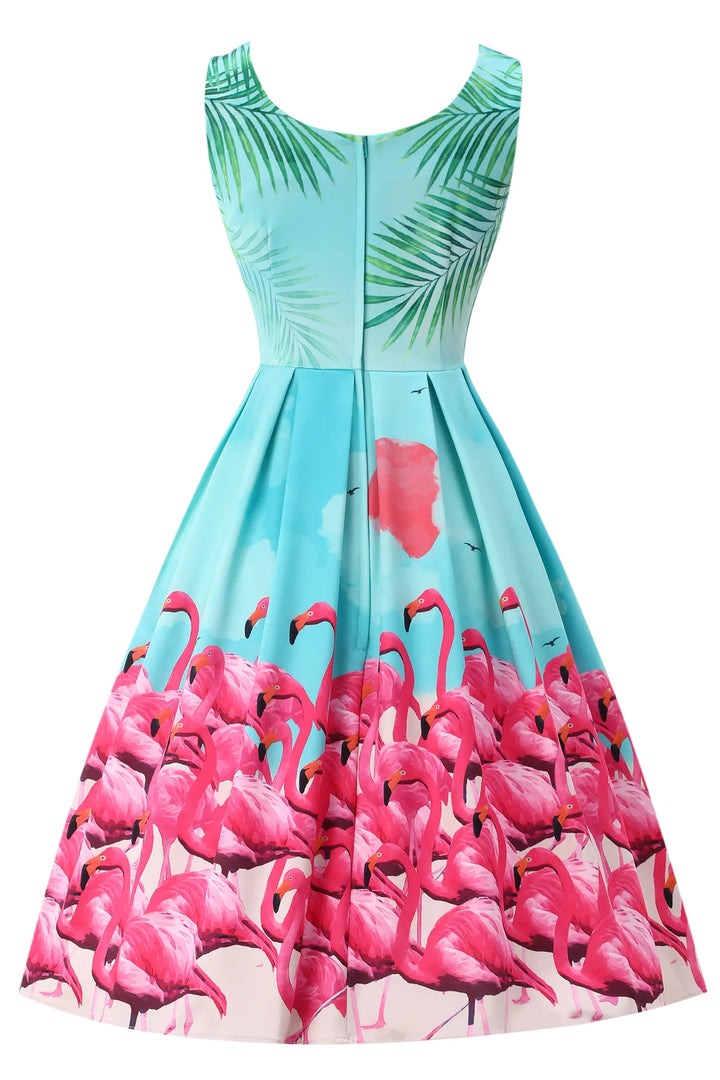 Back view ofDress with pink flamingo and green palm tree pattern on a white background