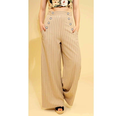 Caspian Swing Trousers - Beige front view on model with hands in pockets