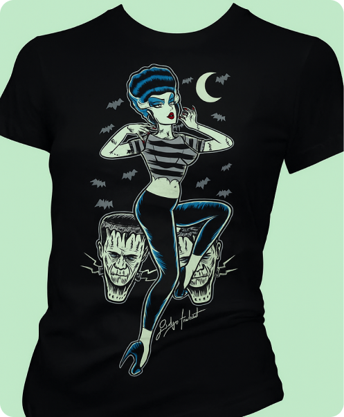 Black women's t-shirt featuring a stylized graphic of a pin-up bride of Frankenstein character against a light green background.