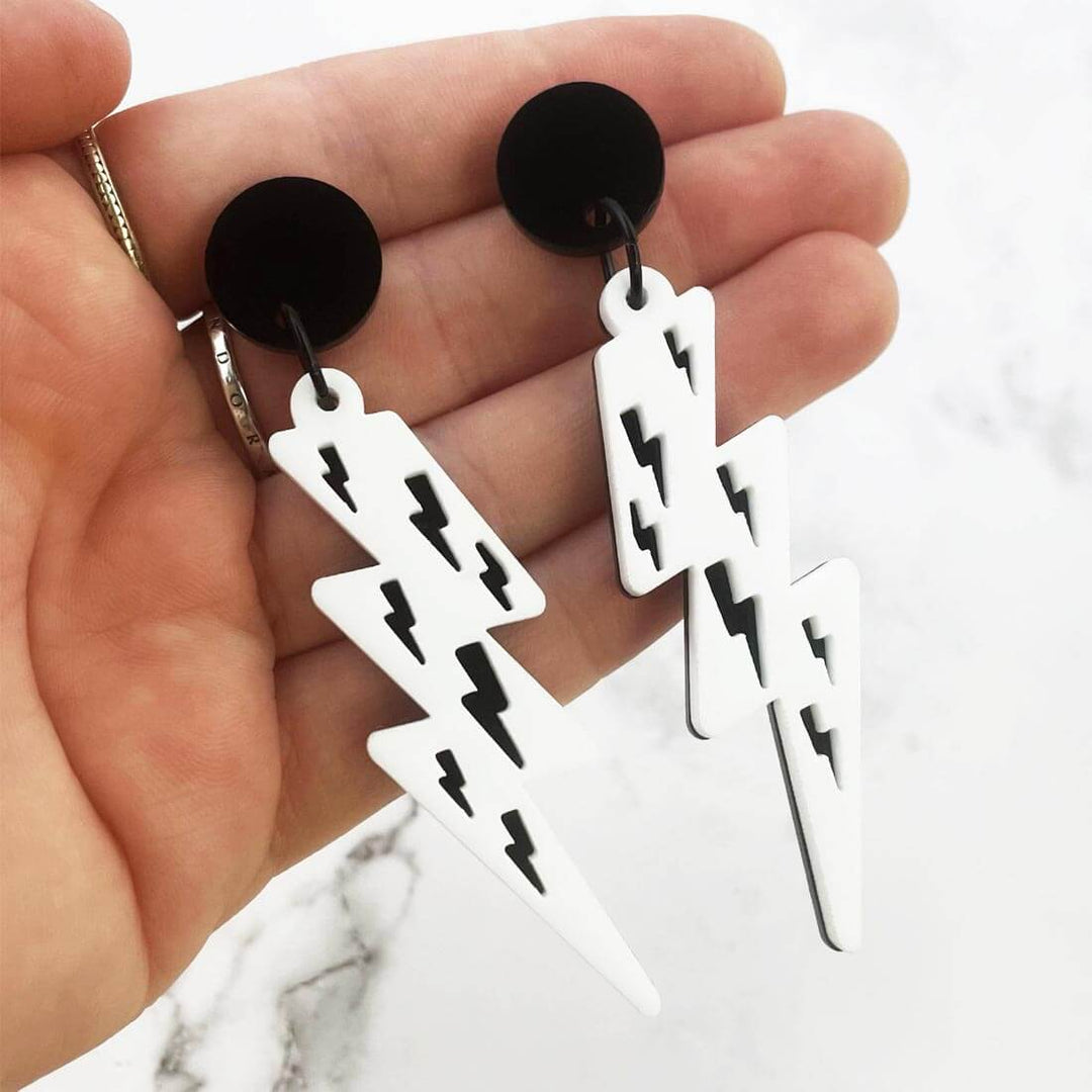 Lost Minds Earrings - Layered Lightning Bolts - Black/White Studs on hand to show size