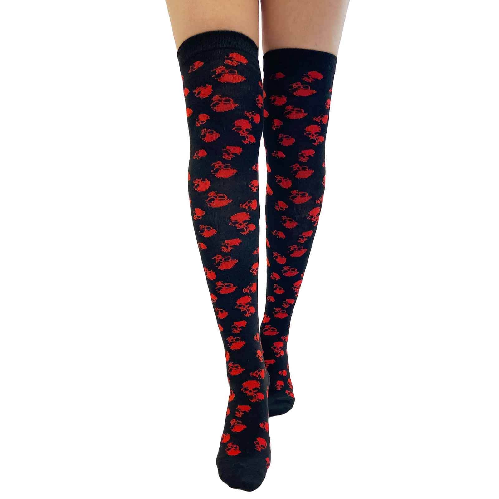 Black over-the-knee socks featuring a repeated red skull pattern on a white background.