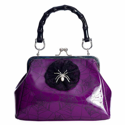 Purple Gothic handbag with spider web and a spider brooch on the front