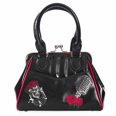 Nashville Rockabilly bag - front view - vintage bag with quilted section at the top in patent vinyl with skull and microphone embroidery on the lower matte vinyl section. Red piping at the sides and a kiss-lock closure.