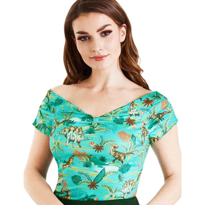 Girl in an off shoulder top with a retro dinosaur print