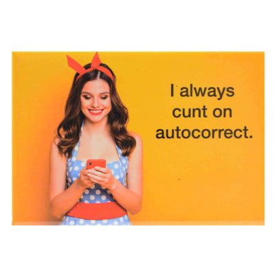 Cute girl in a polka dot dress on her mobile phone and text "I Always Cunt On Autocorrect" on a fridge magnet