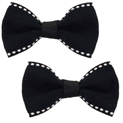 Two hair bows in black with white stitching around the outside