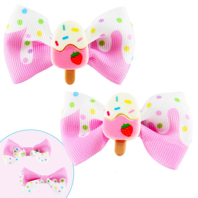 Set of two ice cream hair bows with white at the top and pink at the bottom. There is an ice cream with white sprinkles and pink at the bottom on a stick