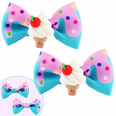 two grosgrain ribbon hair clips with a resin ice cream cone  in the middle