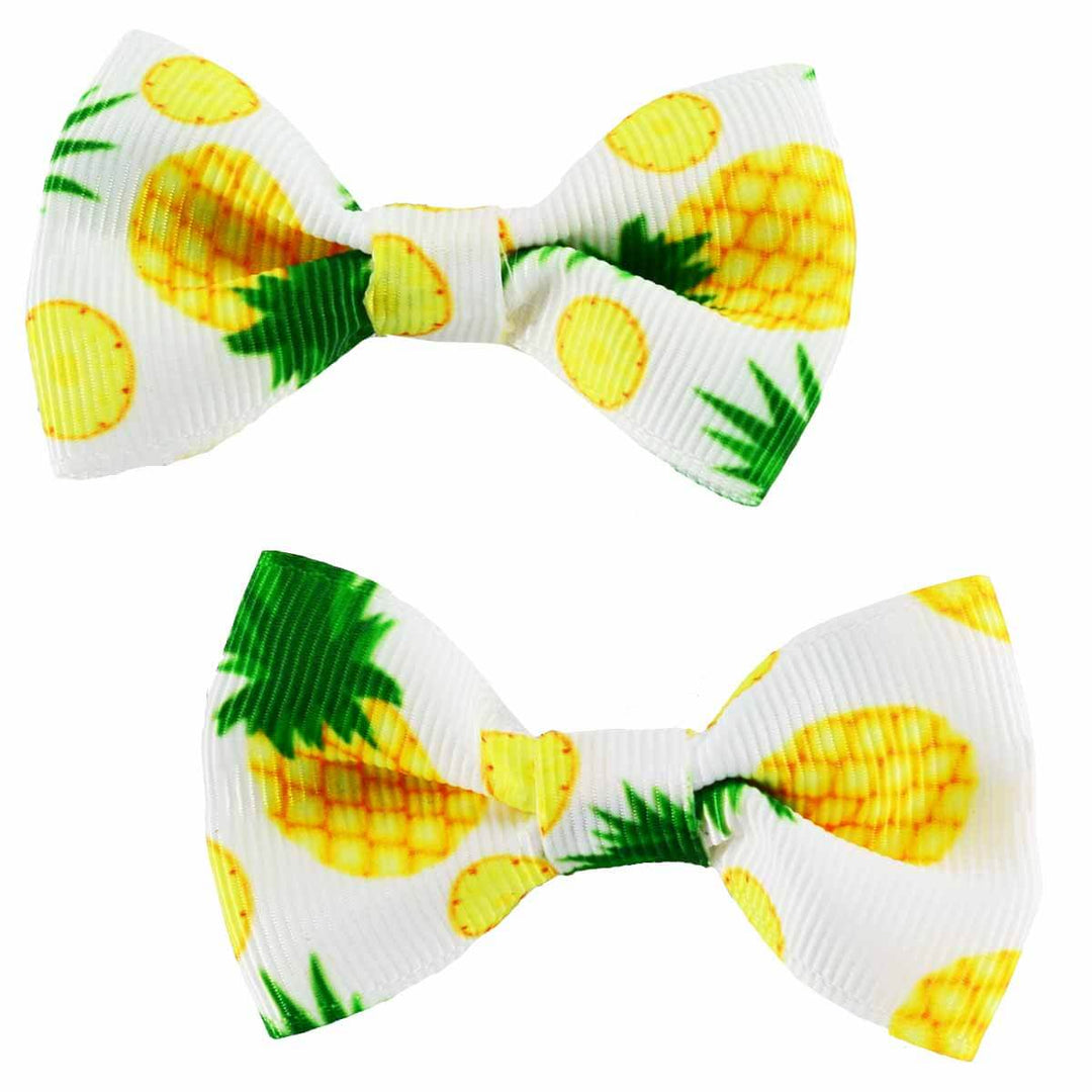 2 cute hair bow/clips with a pineapple motif