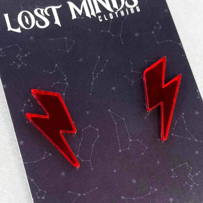80s retro alternative stud earrings. The earrings are laser cut red acrylic cut in a lightning bolt shape