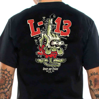 Tattooed man wearing a lucky 13 black t-shirt with "The Fink" lowbrow art motif