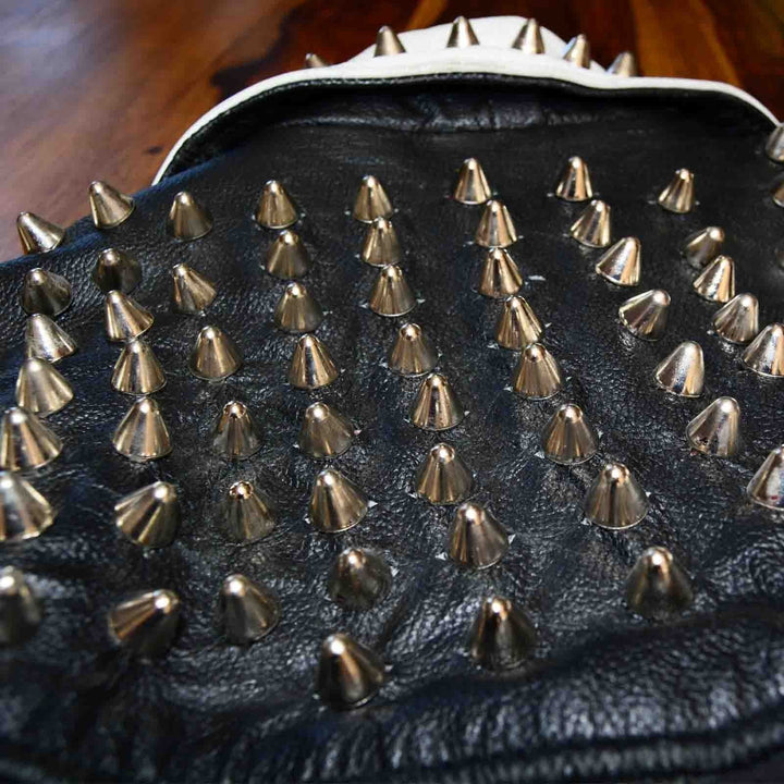 The back of a punk jacket with lots of UK77 Cone Studs 