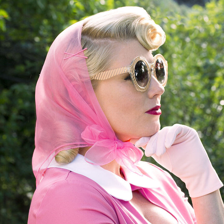 Image of blonde model wearing tidy tresses bright pink scarf